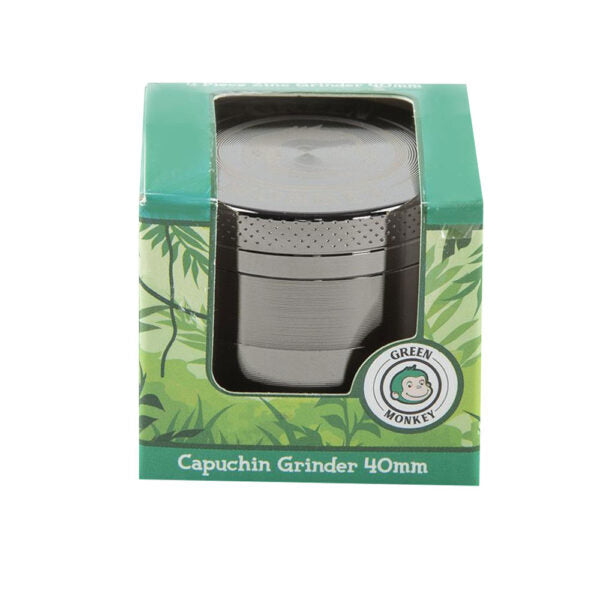 A 40mm capuchin grinder in its original green packaging box, featuring a silver metal grinder visible through a clear plastic window on a white background.
