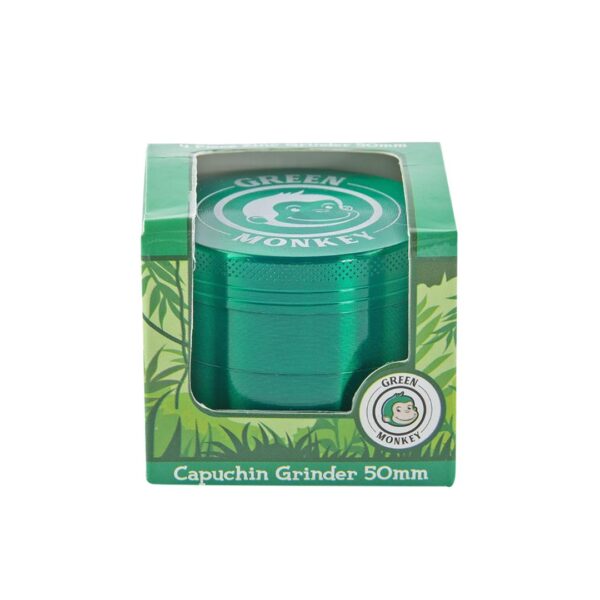 A 50mm green capuchin grinder in its original green packaging box, featuring the Green Monkey brand logo and leaf patterns.