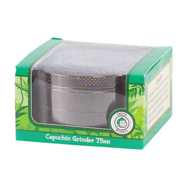 A 75mm capuchin coffee grinder in its original green and white packaging with a clear plastic window, shown on a white background.