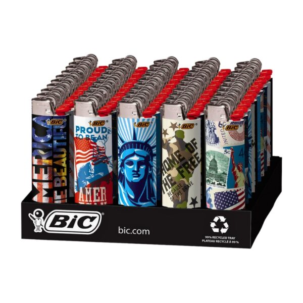 A BIC branded display tray of lighter matches with patriotic designs. The lighter tops are red, and the bodies feature various American-themed graphics including the Statue of Liberty, the American flag, and 'Proud to American' slogans, all set against a plain white background.