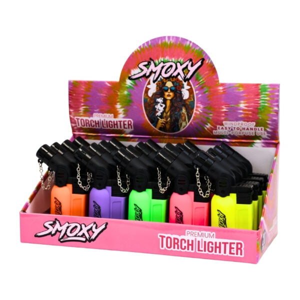 Display of Smoxy torch lighters with colorful packaging on a white background