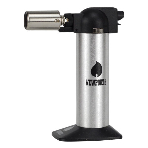 A Newport torch lighter with a brushed silver metal body, black plastic top and base, and a stainless steel nozzle, shown on a plain white background.