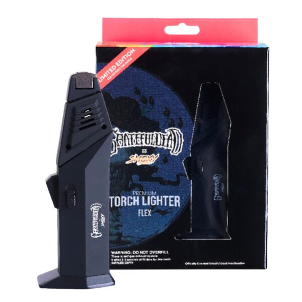 A black Grateful Dead branded torch lighter standing in front of its retail packaging box on a white background.