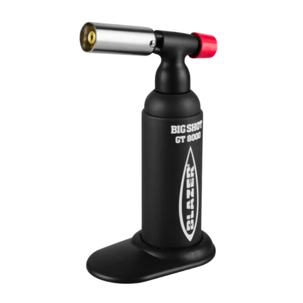 A black handheld torch light with a silver nozzle, red adjustment knob, and black stand base. The body features white text reading 'BIG SHOT GT 8000' and a vertical logo.