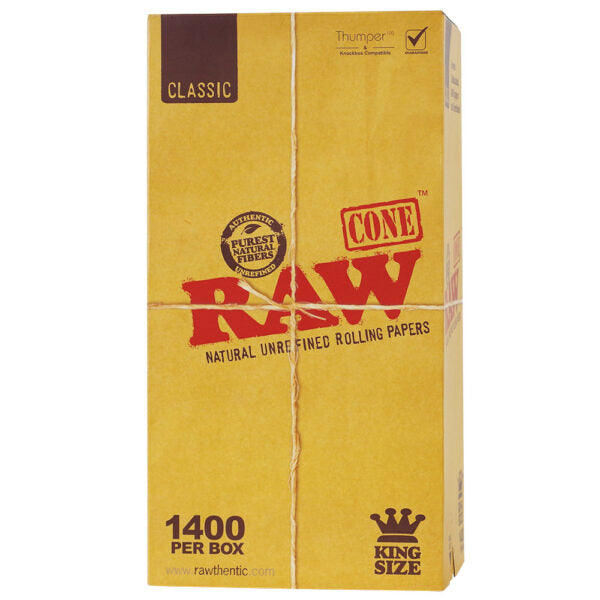 A box of RAW Classic Cone rolling papers, King Size, 1400 per box. The packaging is a textured tan/kraft color with the brand name 'RAW' printed in bold red letters across the center, along with a brown 'CLASSIC' label in the top left corner.