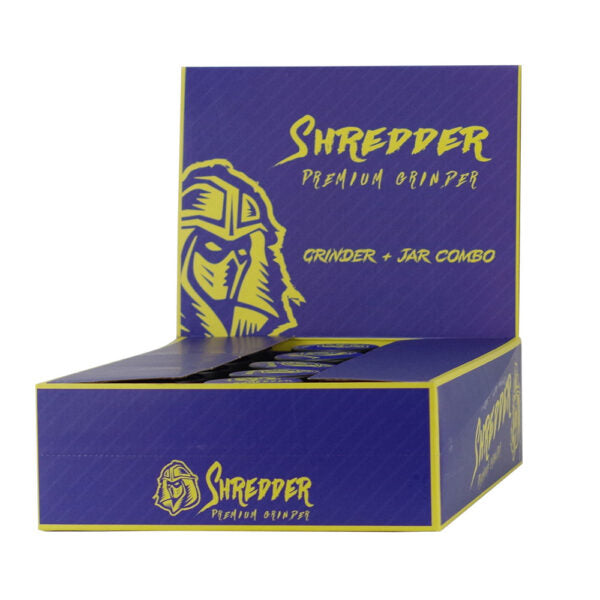 A box of Shredder Premium Grinder grinder and jar combo packaging, featuring a purple and yellow design with a stylized warrior logo.