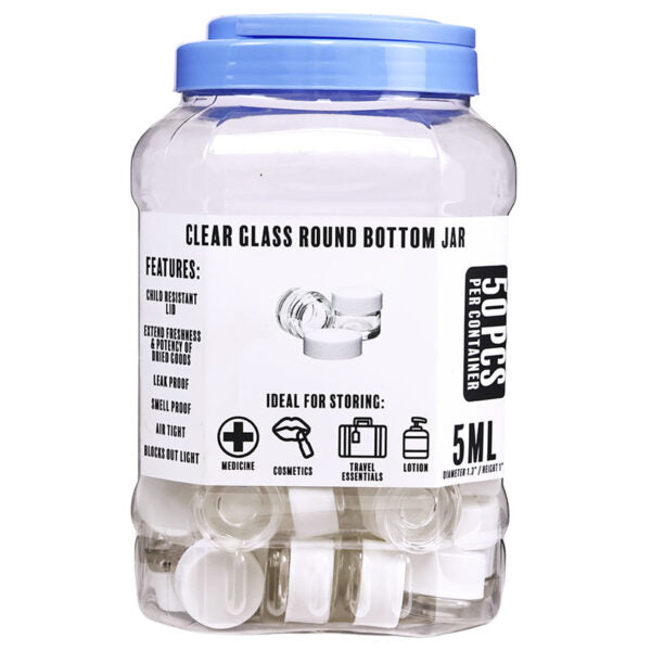 A clear glass round bottom jar with a blue screw-on lid, shown on a white background. The front label reads 'CLEAR GLASS ROUND BOTTOM JAR' and '5ML', with additional text including 'PER CONSUMER OWNERSHIP' and icons for medicine, cosmetics, travel essentials, and lotion.