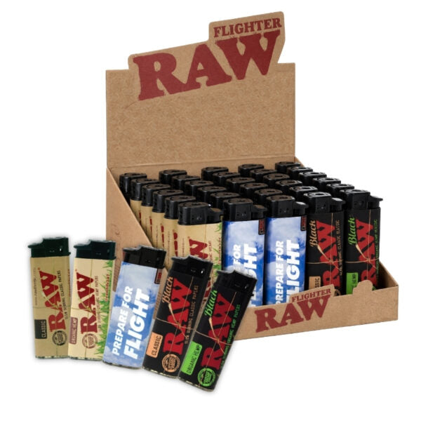 A display box of RAW Fighter Lighters with several individual lighters in different colorways arranged in front on a white background.