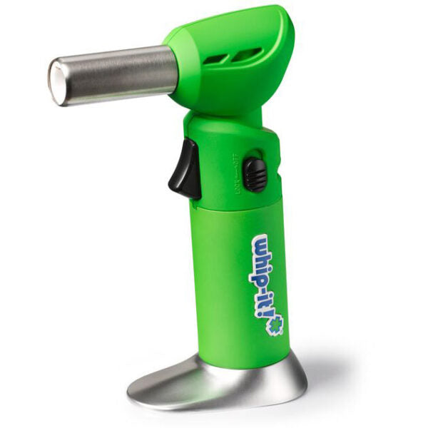 A green handheld torch lighter with a silver metal nozzle and base, featuring a black trigger and a white 'whirl-wind' logo on the side, set against a plain white background.