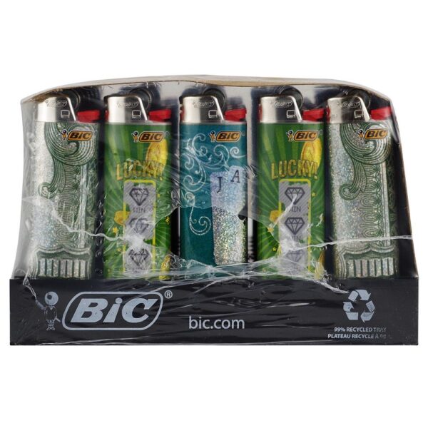 A pack of five BIC Lucky Lighters in a clear plastic blister pack with a black cardboard base. The lighters feature green, teal, and silver designs with 'LUCKY' and diamond motifs.