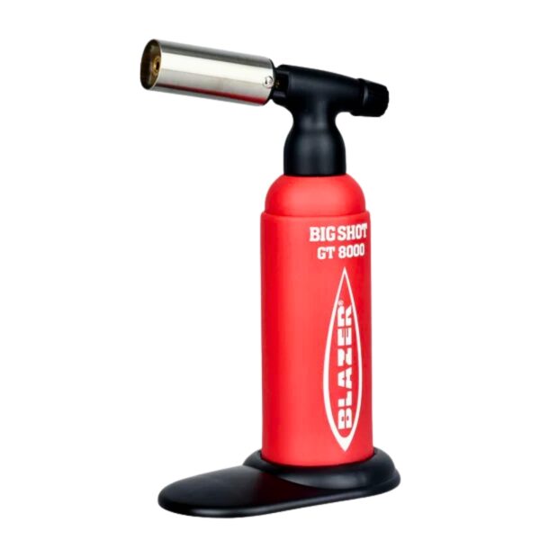 A red and black Blazer Big Shot GT 8000 torch light with a silver nozzle, standing on a black base against a white background.