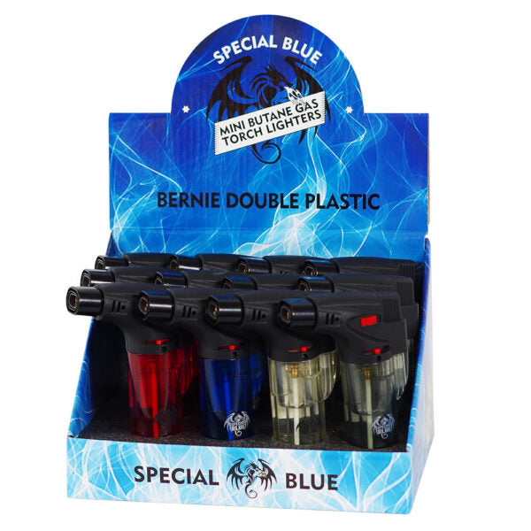 A retail display box containing multiple mini butane gas torch lighters labeled 'SPECIAL BLUE' and 'BERNIE DOUBLE PLASTIC.' The display is blue with printed graphics, and the lighters inside are mostly black with colored plastic bases in red, blue, and clear.