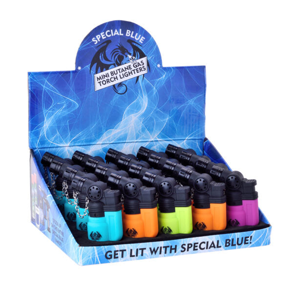 A retail display box filled with mini butane gas torch lighters in assorted colors, including turquoise, orange, green, and purple, under a blue header card labeled 'SPECIAL BLUE'.