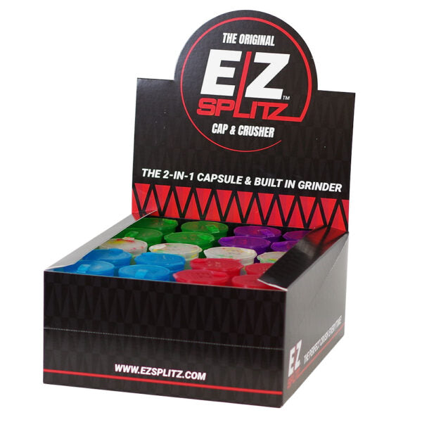 A retail display box of EZ Splitz Caps & Crusher, showing multiple colorful capsule grinders in blue, green, red, and purple inside a black display stand with a prominent EZ Splitz logo.
