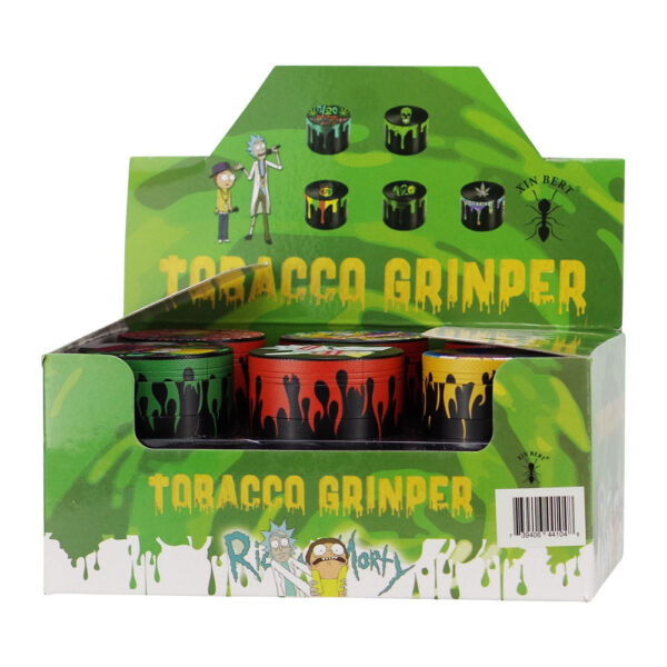 A retail display box of Rick and Morty 'Tobacco Grinper' rolling papers. The green display stand features cartoon illustrations of Rick and Morty, the product name in bold yellow dripping text, and a clear window showing several small rolling paper cups with black lids in green, red, and yellow designs.