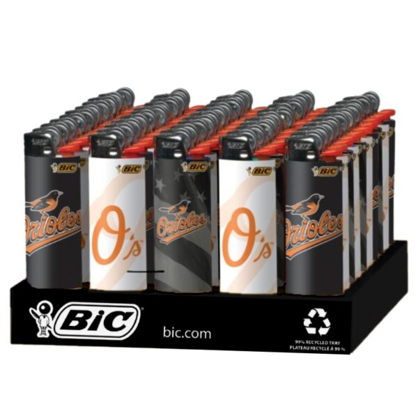 A retail display of BIC BALTIMORE ORIOLES lighters arranged in rows on a black branded stand against a white background.