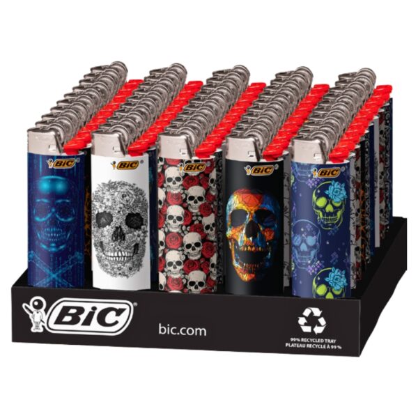 A retail display of BIC lighters featuring various skull and graphic designs on the lighter bodies, with red flip-top caps, set in a black plastic counter tray.