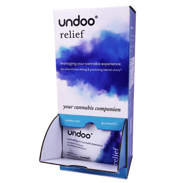 A retail display stand holding a box of Undoo Relief cannabis companion product on a plain white background.