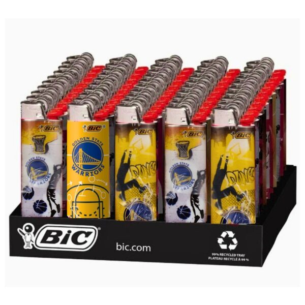 A retail display tray filled with BIC Golden State Warriors lighters. The lighters feature yellow and white graphics with basketball player silhouettes and the Golden State Warriors logo, topped with red caps.