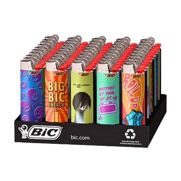 A retail display tray filled with BIC lighters, each featuring a different colorful novelty design on the body and red tops, photographed on a white background.