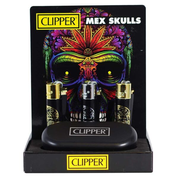 A set of four Clipper brand lighter-style smoking accessories displayed in a black retail stand. The set includes two black and two silver pieces, all with gold-toned tops and ornate black-and-gold skull graphics.
