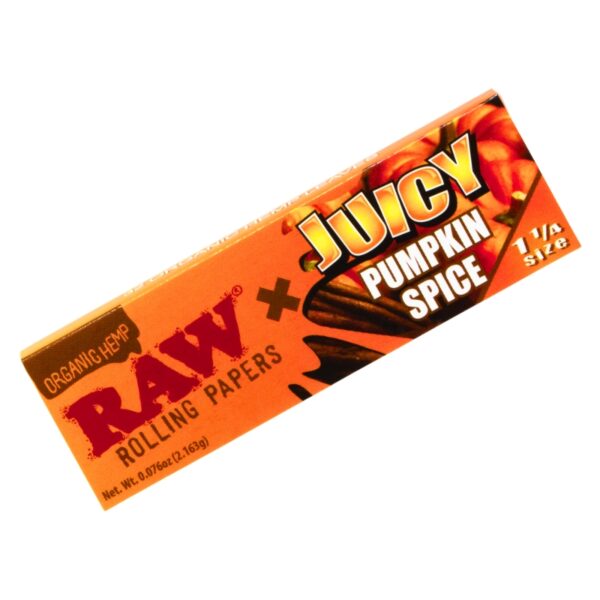 A single RAW rolling papers pack in 'Juicy Pumpkin Spice' flavor, shown diagonally on a plain white background. The packaging is predominantly orange with red and yellow branding text and a graphic of cinnamon sticks and pumpkin seeds.