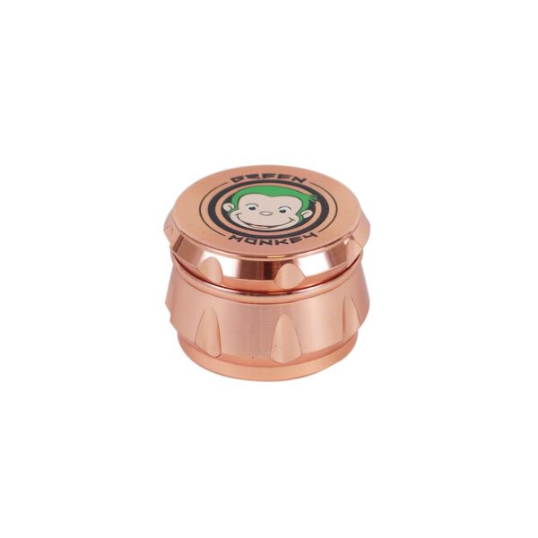 A small metallic copper-toned cylindrical container with a lid featuring a cartoon monkey face and the words 'DEEPEN HUNGER' on a plain white background.