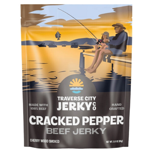 A stand-up pouch of Traverse City Jerky Cracked Pepper Beef Jerky on a plain white background. The packaging features a stylized illustration of a father and child fishing on a dock at sunset, with a dark brown lower section containing white text.