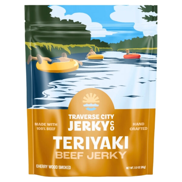 A stand-up pouch of Traverse City Jerky Teriyaki Beef Jerky with a colorful illustration of people floating on inner tubes on a lake, set against a plain white background.