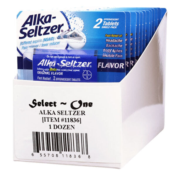 A white cardboard display box holding multiple Alka-Seltzer single-pack sachets, with the front label reading 'Select One ALKA SELTZER [ITEM #11836] 1 DOZEN'. The packs are predominantly blue and white, and the product is photographed on a plain white background.