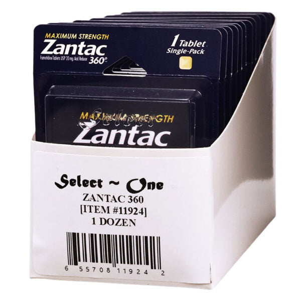 A white cardboard display box holding multiple Zantac 360 single-pack blister cards. The cards are dark blue with white and gold text, and the front box label reads 'Select One ZANTAC 360 [ITEM #11924] 1 DOZEN'.