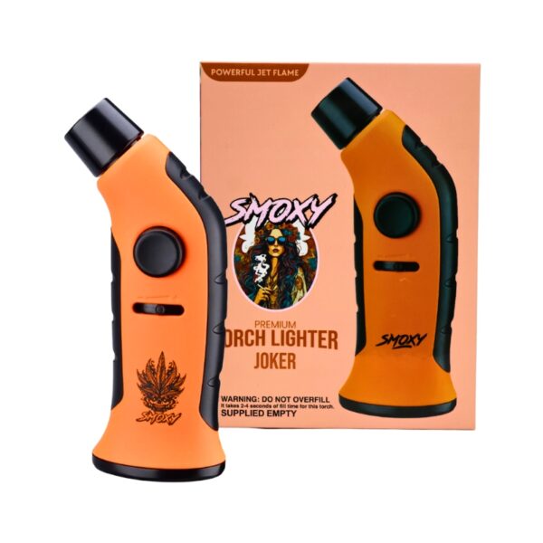 An orange and black Smoxy Premium Torch Lighter shown in front of its peach-colored retail box on a white background.