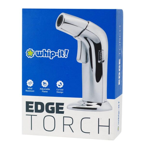 Boxed product photo of a chrome handheld fire extinguisher nozzle on a blue and white retail package. The front shows the product render, the 'whip-it!' logo, feature icons, and large 'EDGE TORCH' text.
