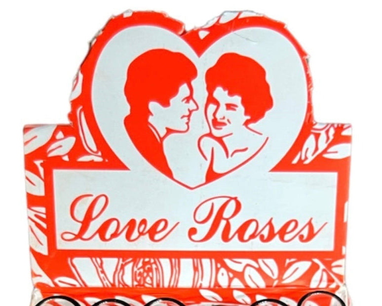Product packaging with a heart design and 'Love Roses' text on a white background