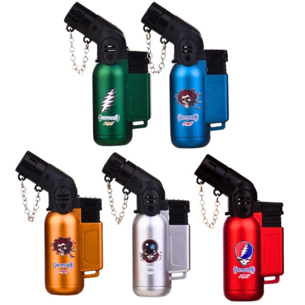 Five portable metal torch lighters in different colors are arranged on a plain white background: green, blue, orange, silver, and red. Each lighter has a black torch head, a chain strap, and a printed Grateful Dead-style skull-and-flame logo near the bottom.