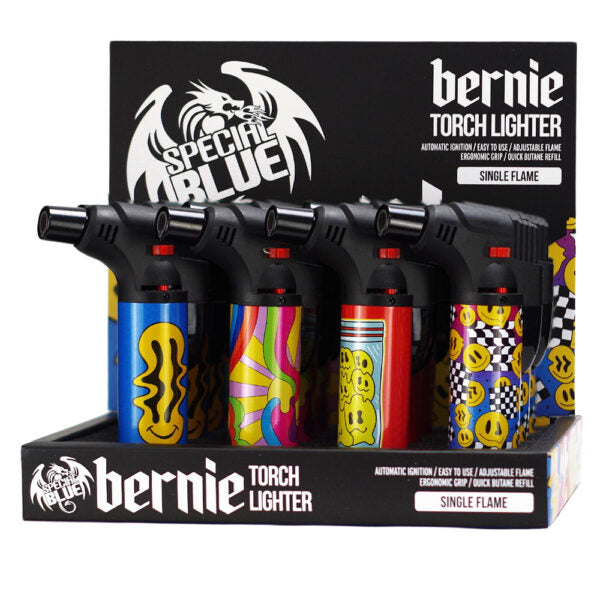 Four Bernie Torch Lighter single flame torch lighters in black with colorful printed designs, displayed in a retail box with black packaging featuring white 'Special Blue' and 'Bernie Torch Lighter' branding.