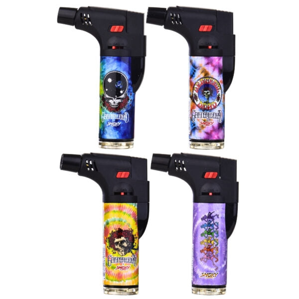Four mini torch lighters arranged in a 2x2 grid on a white background, each featuring a different colorful psychedelic graphic design on the body.