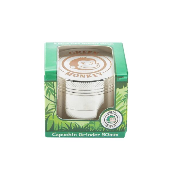 Green Monkey 50mm capuchin grinder in its original green packaging box, featuring a clear window that displays the silver metal grinder inside.