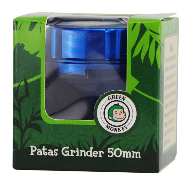 Green Monkey Patas Grinder 50mm in its original retail packaging, featuring a blue metallic top visible through a clear plastic window on a green leaf-patterned box.