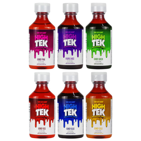 Six bottles of High Tek flavor shots arranged in two rows on a white background. The bottles contain red, purple, green, red, blue, and gold liquids and are labeled with white caps.