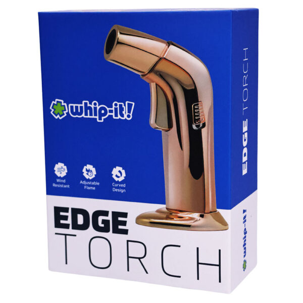 The retail packaging box for the 'whip-it! EDGE TORCH' water spray nozzle. The box features a blue top half and a white bottom half, displaying a graphic of the metallic copper-colored nozzle on the front.
