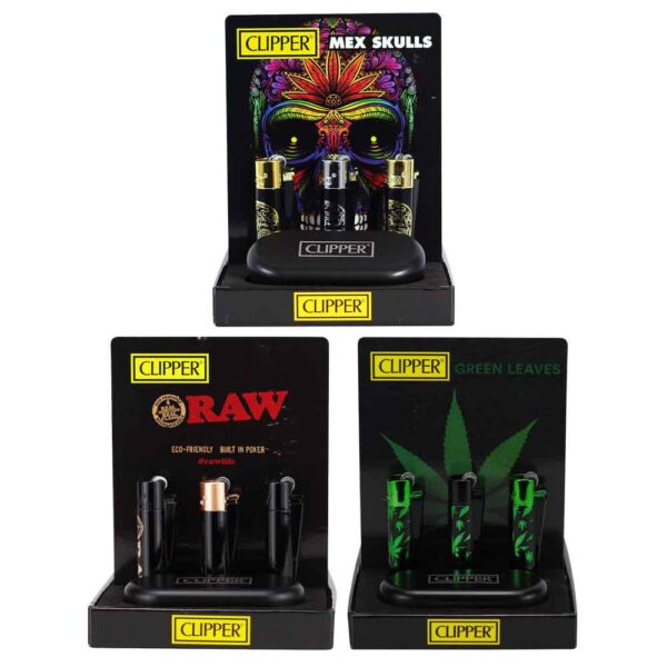 Three Clipper branded lighter display stands on a white background: a tall stand showing black lighter cartridges with a colorful skull graphic, and two shorter stands showing black lighter cartridges, one with a gold-toned lighter and one with green lighter cartridges.