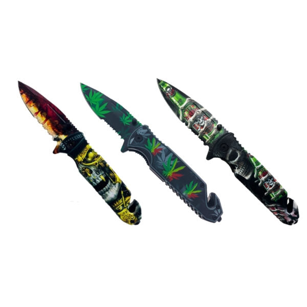 Three folding pocket knives with black handles and colorful skull and cannabis leaf designs, displayed diagonally on a white background.