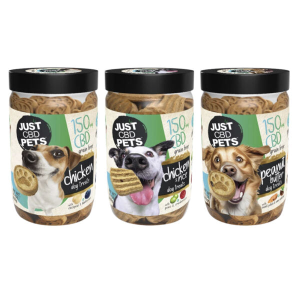 Three jars of Just CBD Pets dog treats on a white background, featuring chicken and peanut butter flavors with images of dogs and treats on the labels.