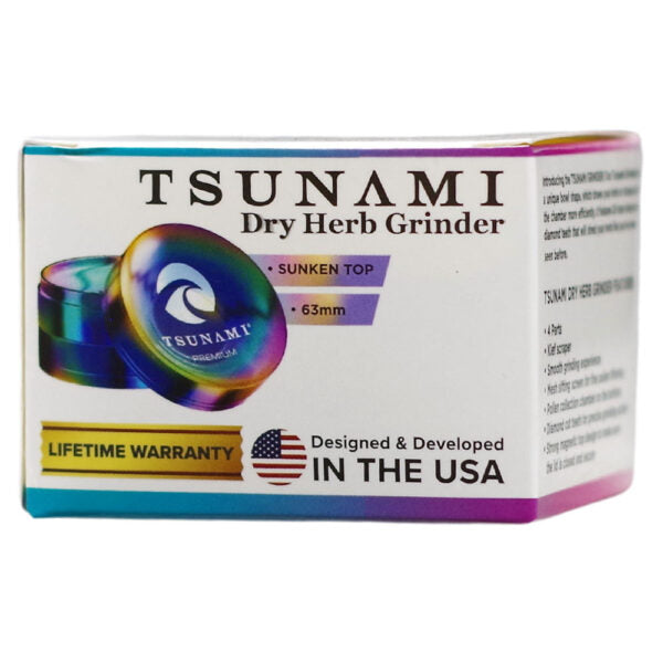 Tsunami Dry Herb Grinder box, featuring a white packaging design with colorful accents, a depiction of the iridescent sunken top grinder, and text highlighting 'Sunken Top', '63mm', and 'Lifetime Warranty'.
