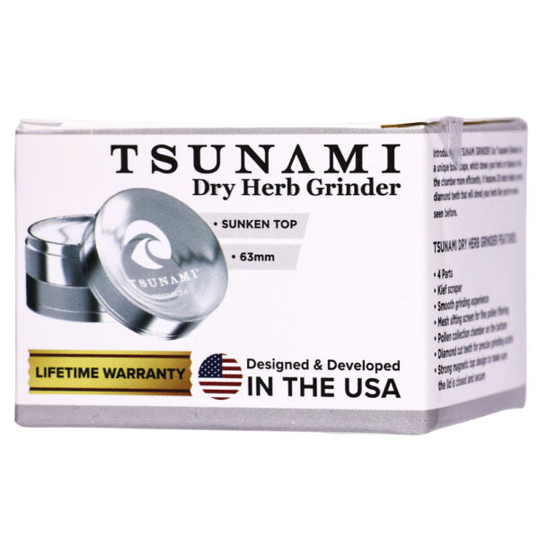 Tsunami Dry Herb Grinder packaging box, featuring a white box with black text, a silver grinder pictured on the front, and a gold 'Lifetime Warranty' banner.