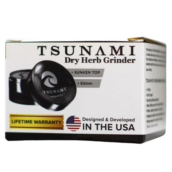 Tsunami Dry Herb Grinder retail packaging box, featuring a black grinder with a sunken top design, on a white background.
