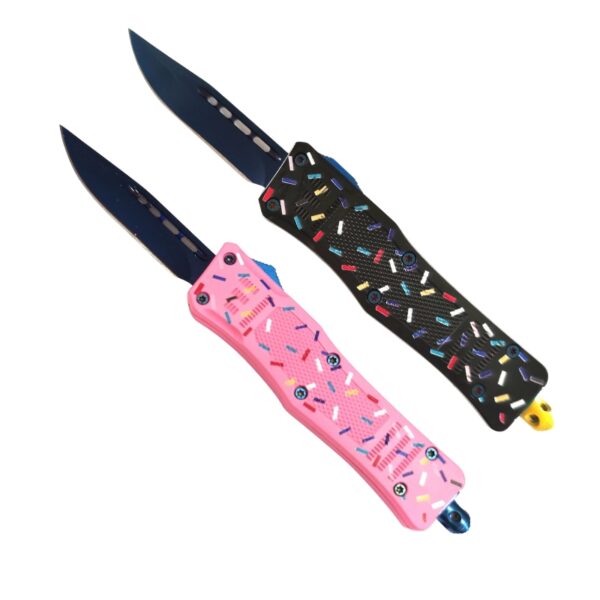 Two folding knives with black blades and handles decorated with a colorful sprinkle pattern, shown on a plain white background.