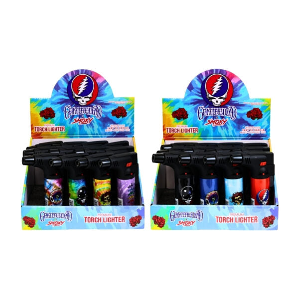 Two retail display boxes of Grateful Dead 'Smoxy' flameless torch lighters on a plain white background.